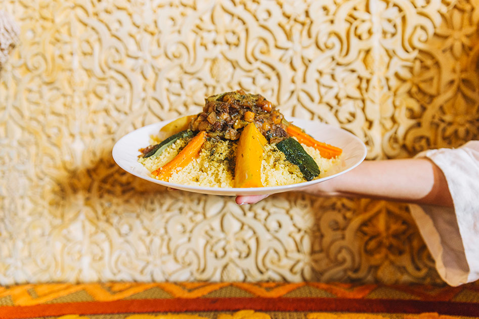 Hand holding a Moroccan Couscous 1